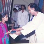 Ranjani receiving the award from Kadri Gopalnath